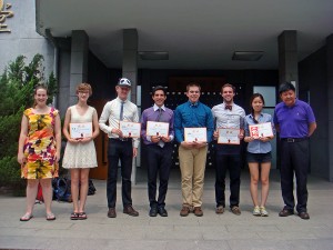 Members of the UW–Madison team at 2014 Chinese Speech Contest of U.S. Summer Programs in China include, from left, Nichole Springer, Alison Sharpless, Matthew McGee, Seth Valenziano, Samuel Rosiejka, Benjamin Adams, and Soobin Im, with Hongming Zhang.
